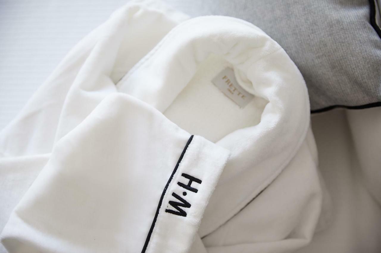 The Whitney Hotel Boston Extérieur photo A white shirt with a monogram